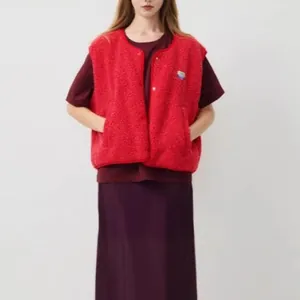 Detail of a bright red sleeveless fleece vest with single-breasted front buttons