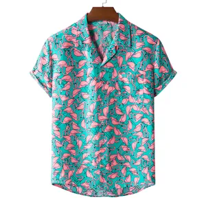 Close-up of men's short-sleeved shirt featuring vibrant pink flamingo print on teal