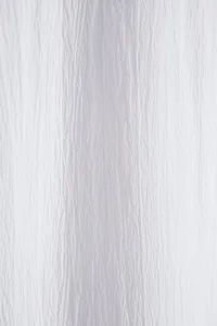 Macro view showing the breathable white crinkle texture fabric of a men's shirt