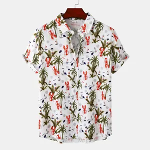 Detail of white men's short sleeve shirt with tropical lobster and palm tree print