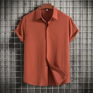 High-quality detail of men's summer short sleeve shirt with textured fabric and button-down style