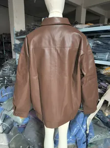 Detailed back view of an oversized brown faux leather biker jacket on a mannequin