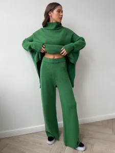 Cozy green oversized turtleneck sweater and matching knit wide-leg pants set.