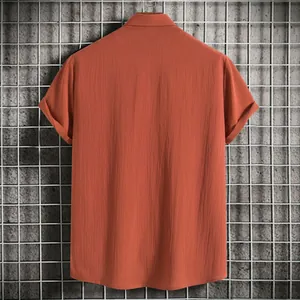 Detailed back view of men's terracotta short-sleeved shirt with textured linen fabric