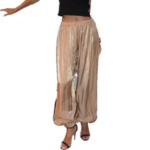 Eleganti pantaloni harem metallizzati color oro champagne per donna con vestibilità morbida