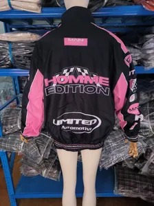 Vintage racing style motorcycle jacket with pink and black patchwork and bold text detail