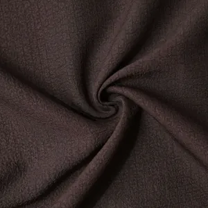 High resolution macro view of brown ripstop fabric texture for men's summer short sleeve shirt