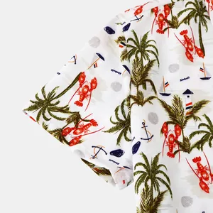 Detail view of men's beach shirt featuring vibrant lobster and palm tree patterns