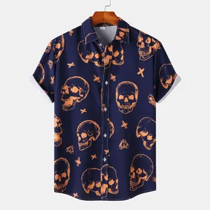 Close-up of the orange skull and cross pattern on a navy blue short-sleeve shirt