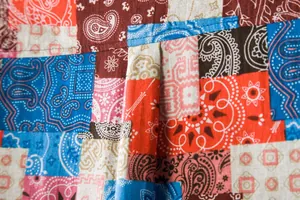 Detailed macro view of vibrant patchwork paisley pattern on cotton-linen fabric