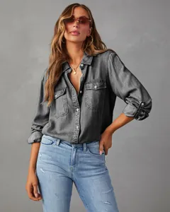 Fashionable grey washed denim button-down shirt with front pockets worn by a model
