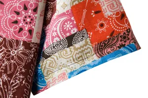 Detail view of men's breathable linen short sleeve shirt with vibrant patchwork pattern