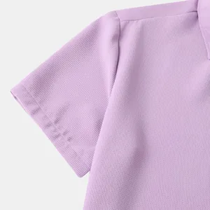 Close-up detail of lavender men's casual shirt showing fine honeycomb fabric texture