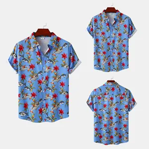 Detail view of men's short-sleeve beach shirt with vibrant red lily and fish pattern print