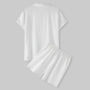 Back view of men's white short-sleeve linen-style shirt and shorts set with textured fabric