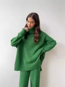 Chic oversized green turtleneck sweater and matching knit trousers set for women