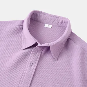 Close-up of lavender men's casual shirt featuring waffle texture and collar detail.