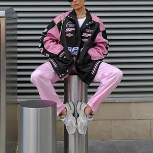 Stylish women's racing jacket featuring pink color-blocking and sporty patch details