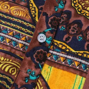 Close-up of Hawaiian print shirt fabric with colorful ethnic patterns and button