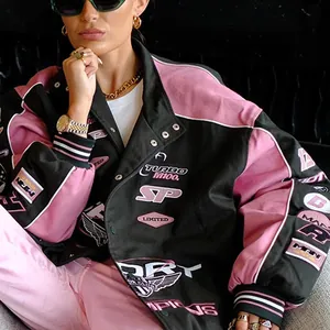Close-up detail of black and pink motor jacket with vintage style embroidered patches