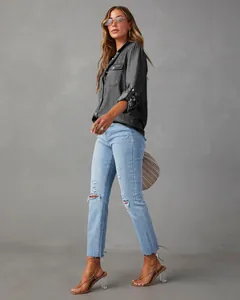 Professional studio shot of a woman in a casual dark grey denim shirt with pockets