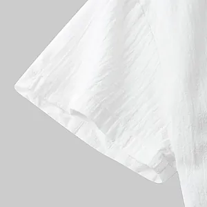 Detail view of white short sleeve shirt showing breathable cotton linen fabric texture
