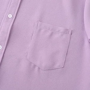 Detailed view of lavender waffle-knit men's casual shirt with chest pocket and white buttons