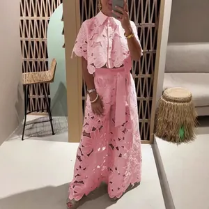 Elegant pink floral lace two-piece set featuring a hollow-out cardigan and wide-leg pants
