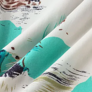 Detailed view of breathable fabric with Hawaiian tropical print for men's beach shirt