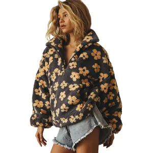 Stijlvol antraciet fleece sweatshirt met geel bloemenpatroon en opstaande kraag met rits.