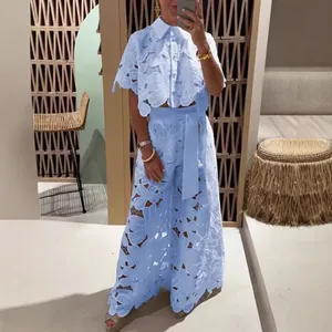 Light blue lace two-piece set with hollow out cardigan and matching wide leg pants.