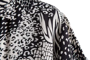 Detail view of the black and white abstract pattern on a casual men's shirt