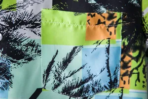 Close-up detail of pocket and ethnic palm print on Hawaiian short sleeve shirt