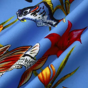Macro view of tropical fish and flower print fabric for men's summer beach shirt