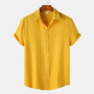 Men's yellow textured short-sleeved button-down shirt hanging on a classic wooden hanger