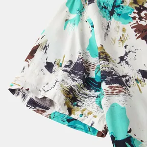 Detail shot of a men's Hawaiian casual shirt featuring colorful abstract brushstroke prints