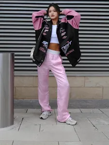 Stylish women's black and pink printed racing jacket for casual streetwear fashion.