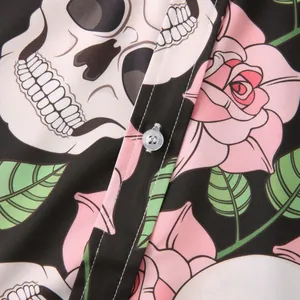 Macro detail of men's Hawaiian shirt featuring skull and rose print and button closure
