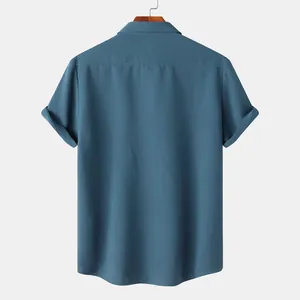 Back view of a blue textured short-sleeved casual shirt for men on a hanger.