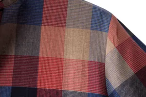 Close-up detail of a men's plaid linen shirt showing breathable fabric texture