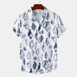 Detailed view of the seashell print on a white men's short-sleeved beach shirt
