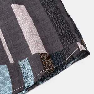 Detailed view of the fine texture and stitching on this men's striped short-sleeve shirt