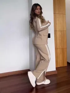 Casual women's tan blazer and wide-leg pants two-piece set featuring sporty white side stripes