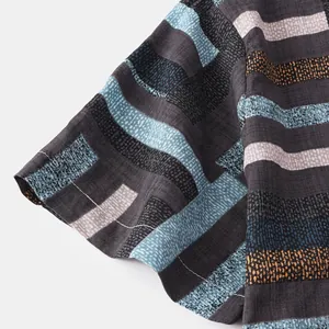 Close-up of striped fabric and sleeve detail on men's short sleeve casual shirt