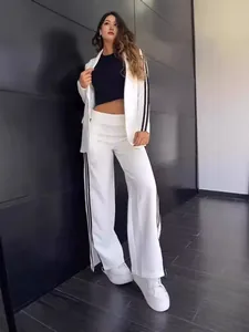 Elegant white women's blazer and wide-leg pants suit with sporty black side stripes