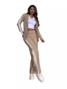 Elegant beige two-piece blazer and wide-leg trousers set with sporty white stripes.