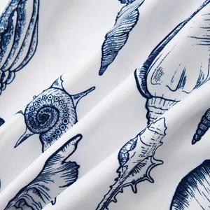 Detailed macro view of navy blue seashell pattern on white fabric for beach holiday shirts