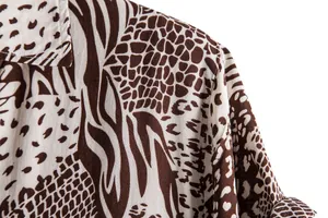 Close-up of brown animal print pattern on men's casual short-sleeved shirt
