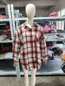 Detailed view of women's pink plaid button-down shirt with chest pocket on mannequin