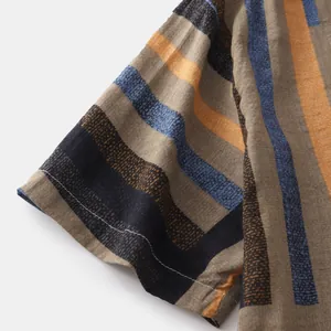 Close-up detail of casual men's shirt sleeve with vibrant color-block stripes and stitching